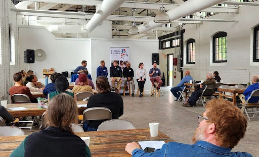 Training workshop held indoors with speakers